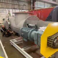 Engineers working on pressurised screw conveyor for Indian Oil - Spirotech Group UK