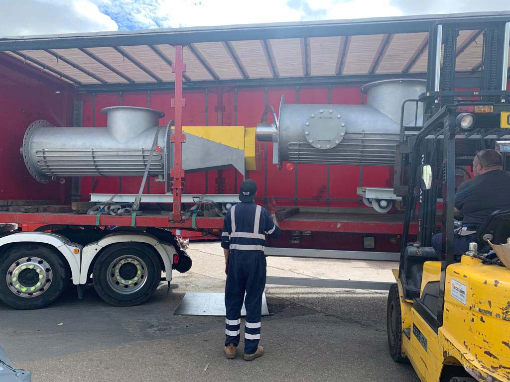 Pressurised screw conveyors for Indian Oil being loaded for delivery - Spirotech Group UK